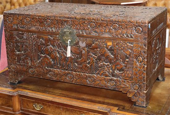 A Chinese carved camphorwood chest W.104cm